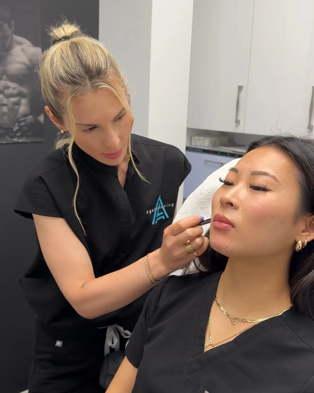 An Ageless Living practitioner mapping a patient’s face before neuromodulator treatment